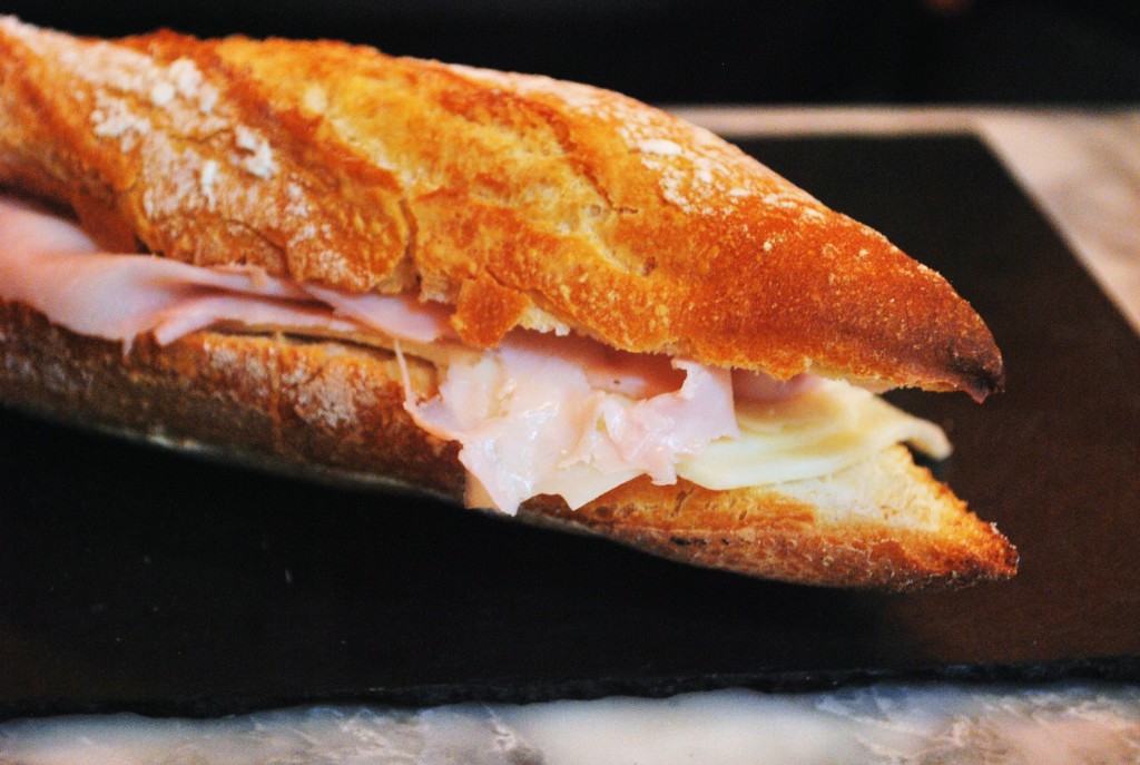A sandwich of deli meat and baguette.