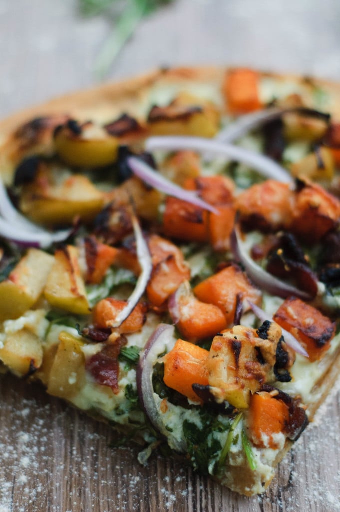 Close up of a slice of autumnal harvest pumpkin pizza.