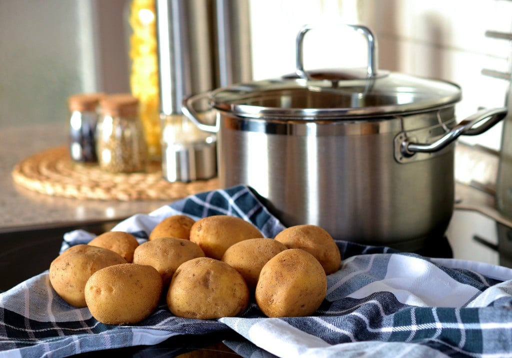 A pot with potatoes in front of getting ready to make mashed potatoes.