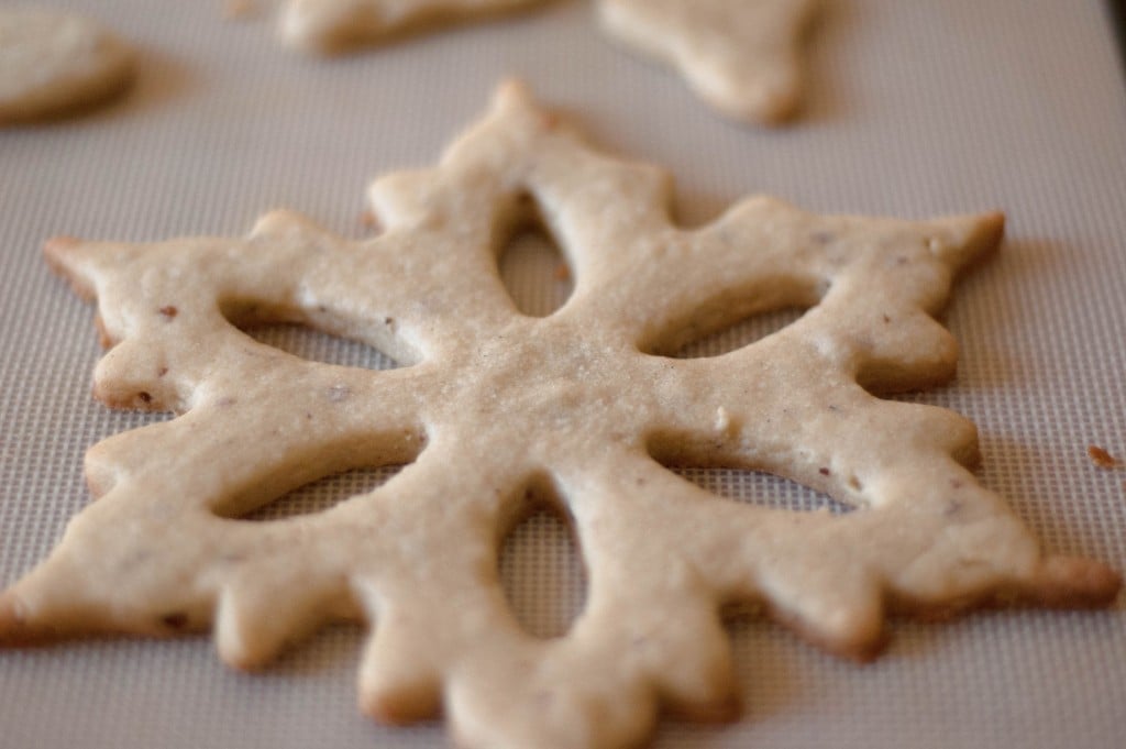 A large snowflake shaped cookie made from almond cookie dough.