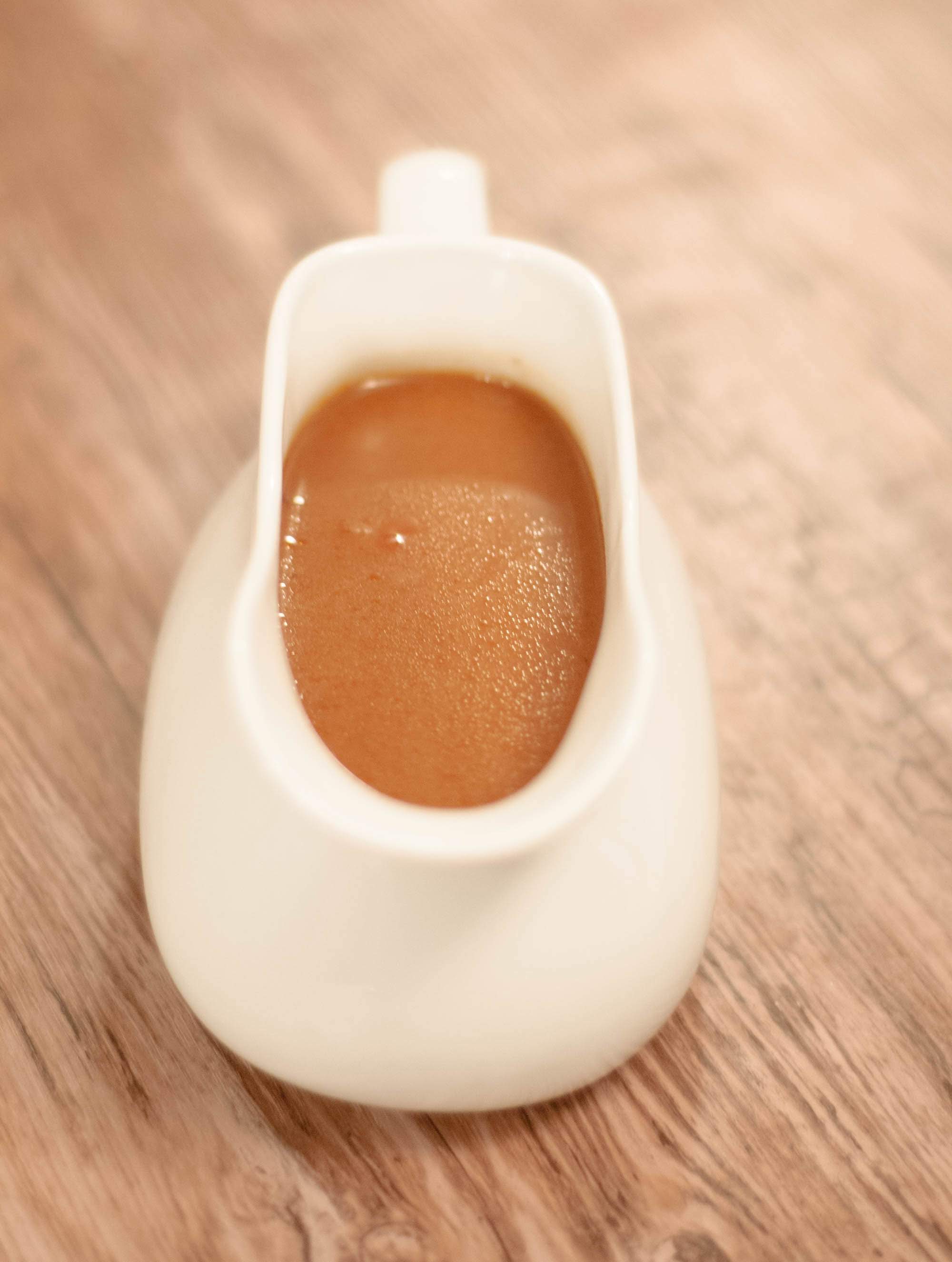 A gravy boat of espagnole sauce