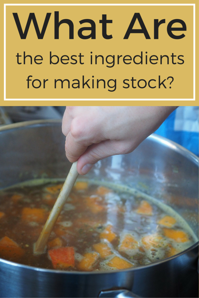 A spoon stirring a large pot making chicken stock.