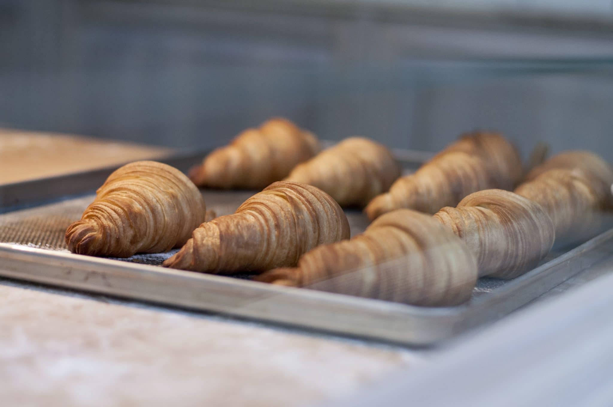 Baked goods on a sheet pan in a window.