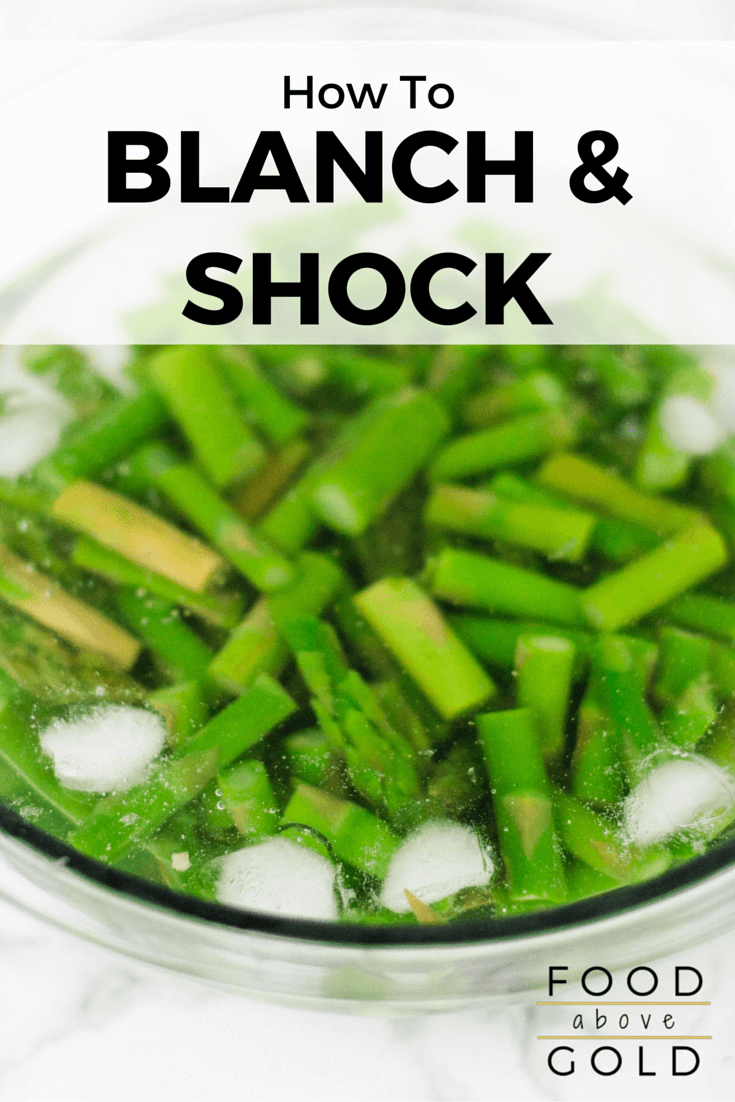 Asparagus being shocked in a bowl of ice water after being blanched.  Text says "how to blanch and shock."