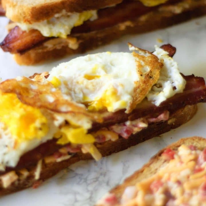 an open face Pimento Cheese, Bacon and Fried Egg Sandwich