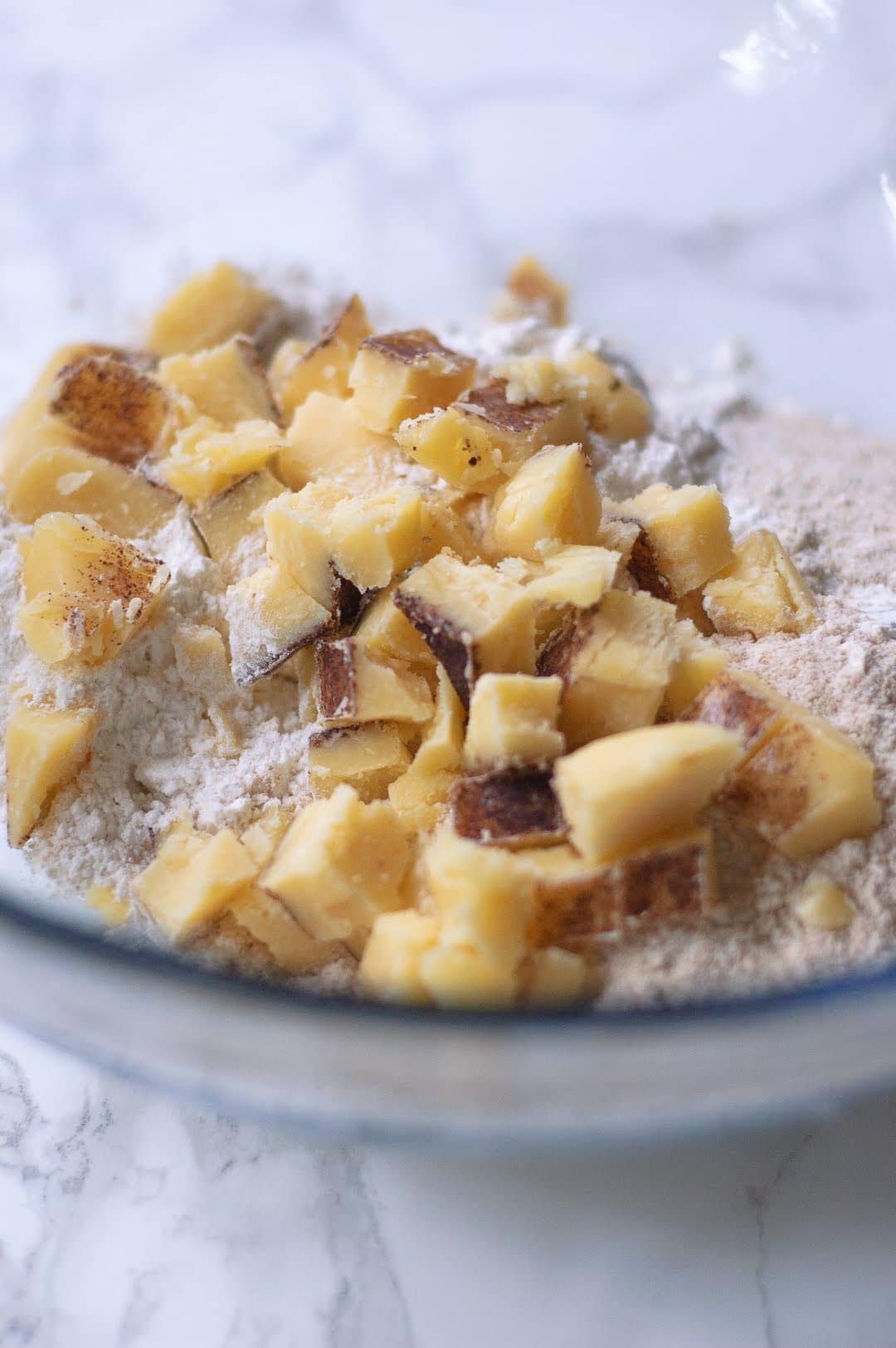 bowl of cut up brown butter in flour