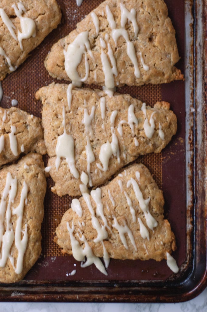 overhead shot of baking sheet of cooked brown butter and pumpkin seed scones