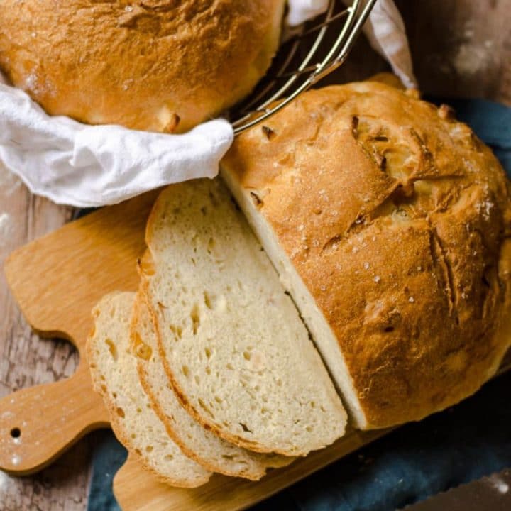 overhead view of a partially sliced loaf of apple olive oil bread