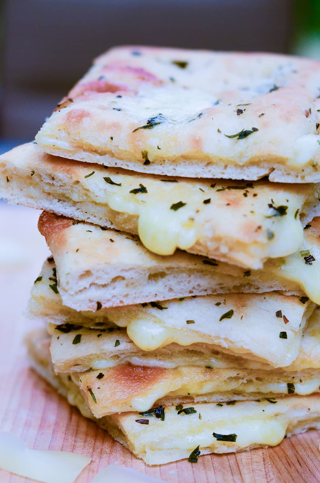 stack of gourmet slab grilled cheese with boom boom syrah and glass of wine