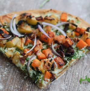 close up of a single slice of pumpkin pizza