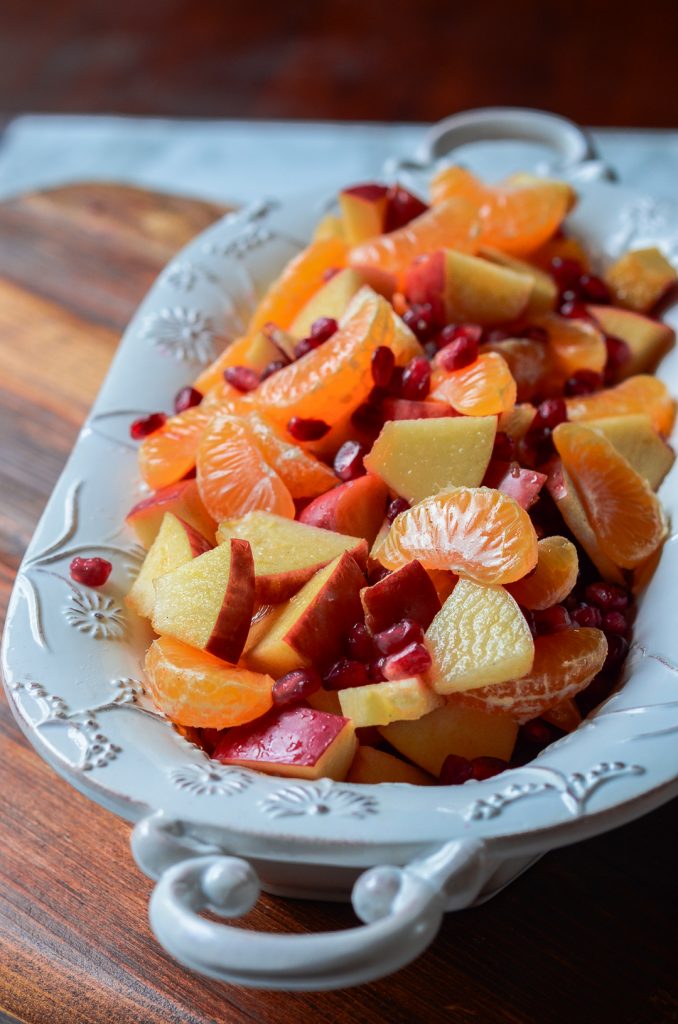 A bowl of winter fruit salad with cinnamon vanilla dressing