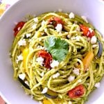 White bowl of cilantro pesto pasta