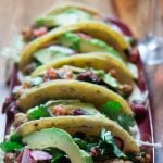 A row of five fried oyster tacos