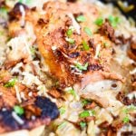 Cooked crispy chicken skin on chicken thighs.