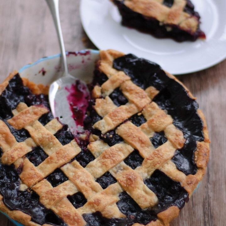 A cut blueberry pie