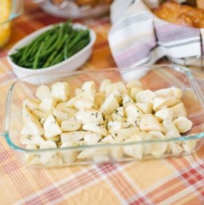 A clean dish of easy roasted parsnips on an autumnal colored tablecloth