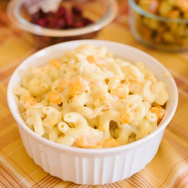 close up of a white bowl of creamy mac and cheese.