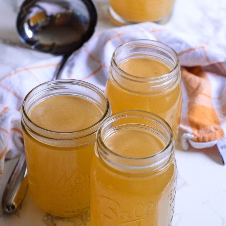 A jar filled with turkey stock