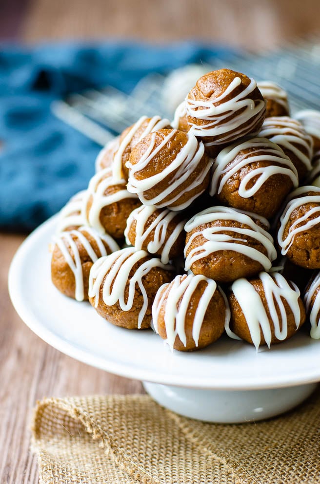 A pedestal piled high with Biscoff no bake truffles drizzled with white chocolate.