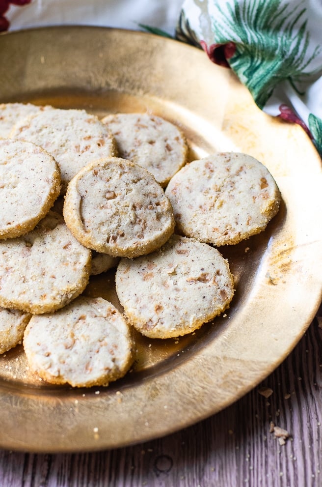 A large gold plate filled with shortbread cookies