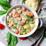 overhead view of a white bowl of one pot lasagna soup