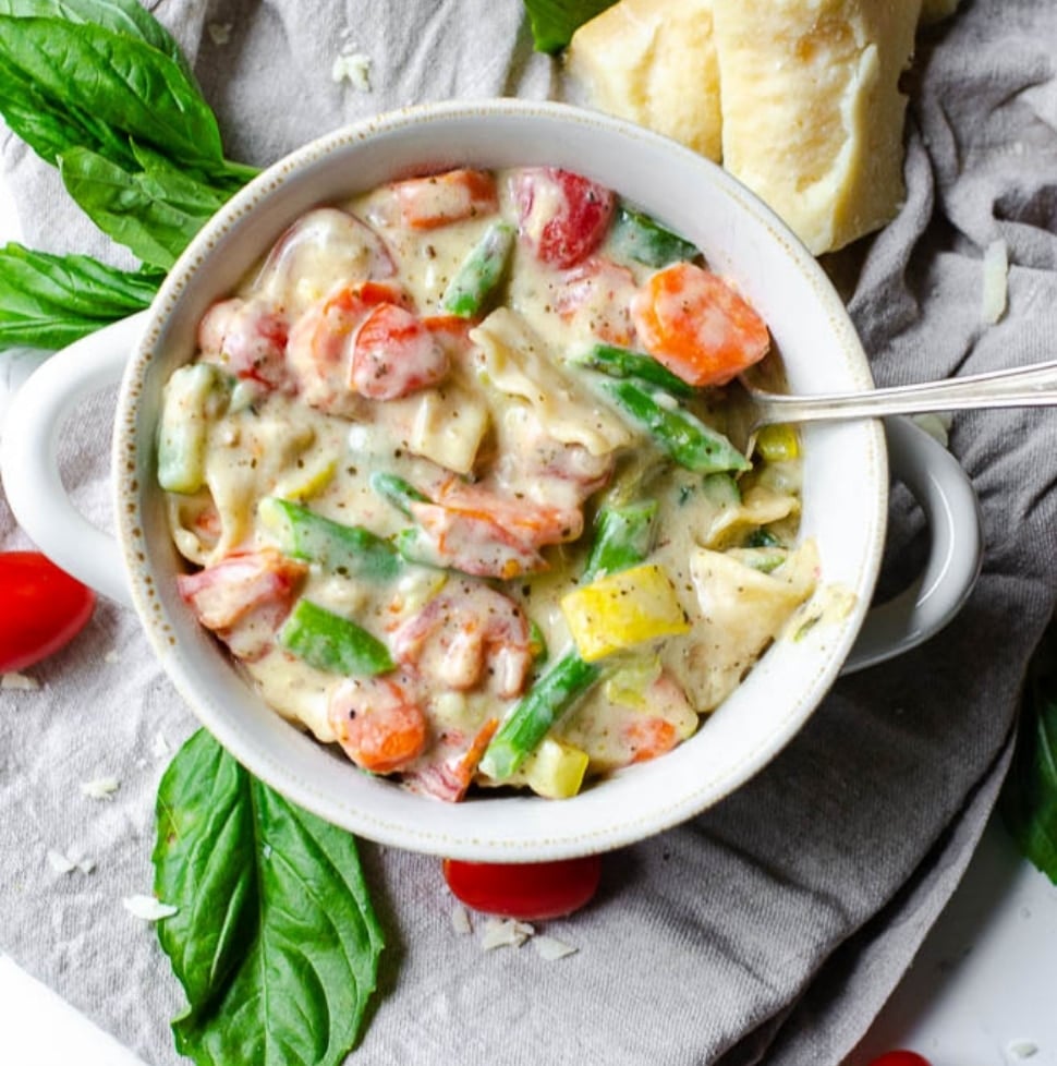 overhead view of a white bowl of one pot lasagna soup