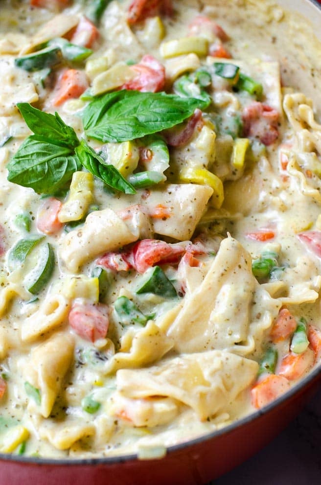 close of of fresh basil on top of one pot lasagna soup