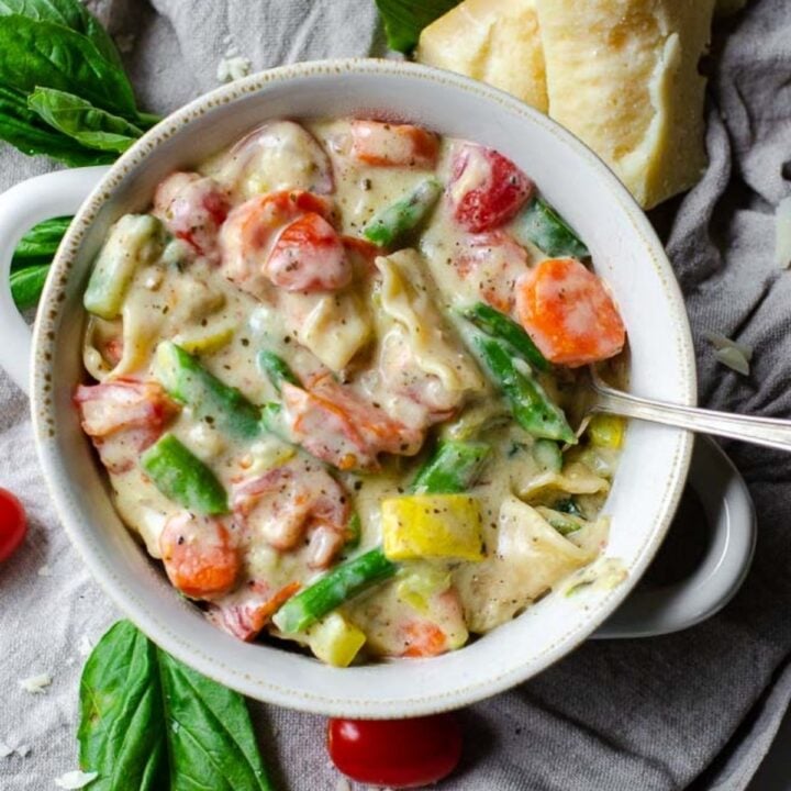 A white bowl of vegetable soup