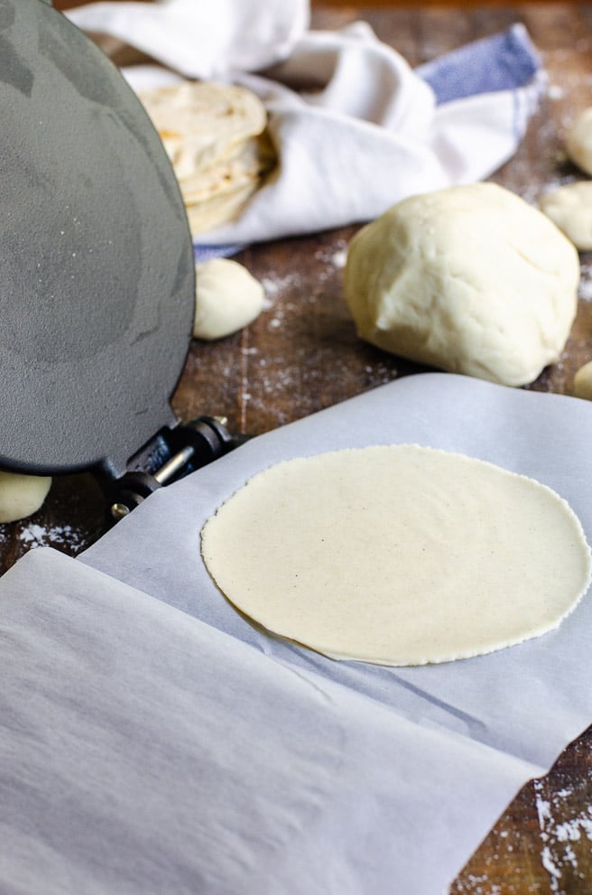 flattened our fresh corn tortilla made on a cast iron tortilla press