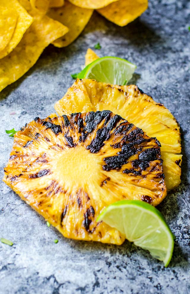 closeup of light char marks on a grilled pineapple slices