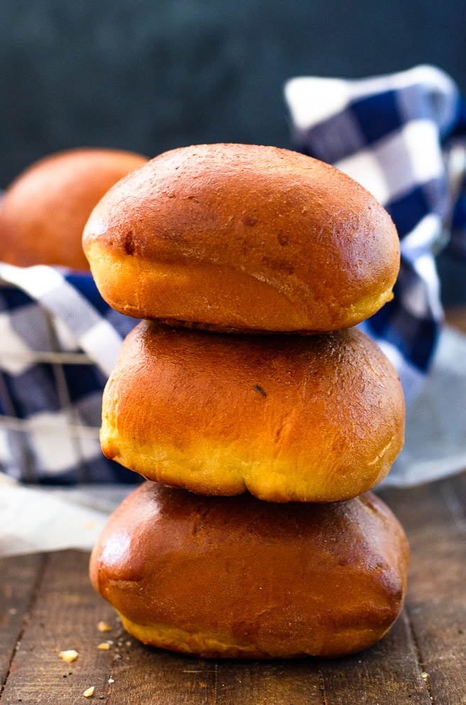three burger buns stacked on each other.