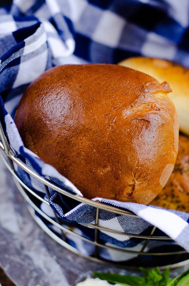 Basket of golden brown brioche hamburger buns