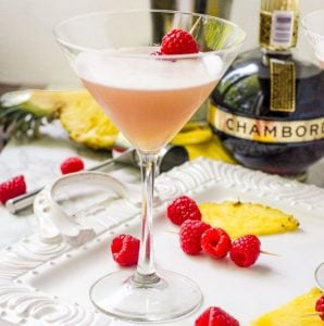 a tray of fruit with a french martini