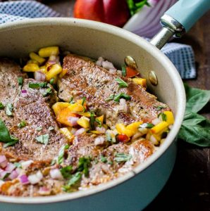 blue Rachel Ray skillet with pan seared pork chops in it