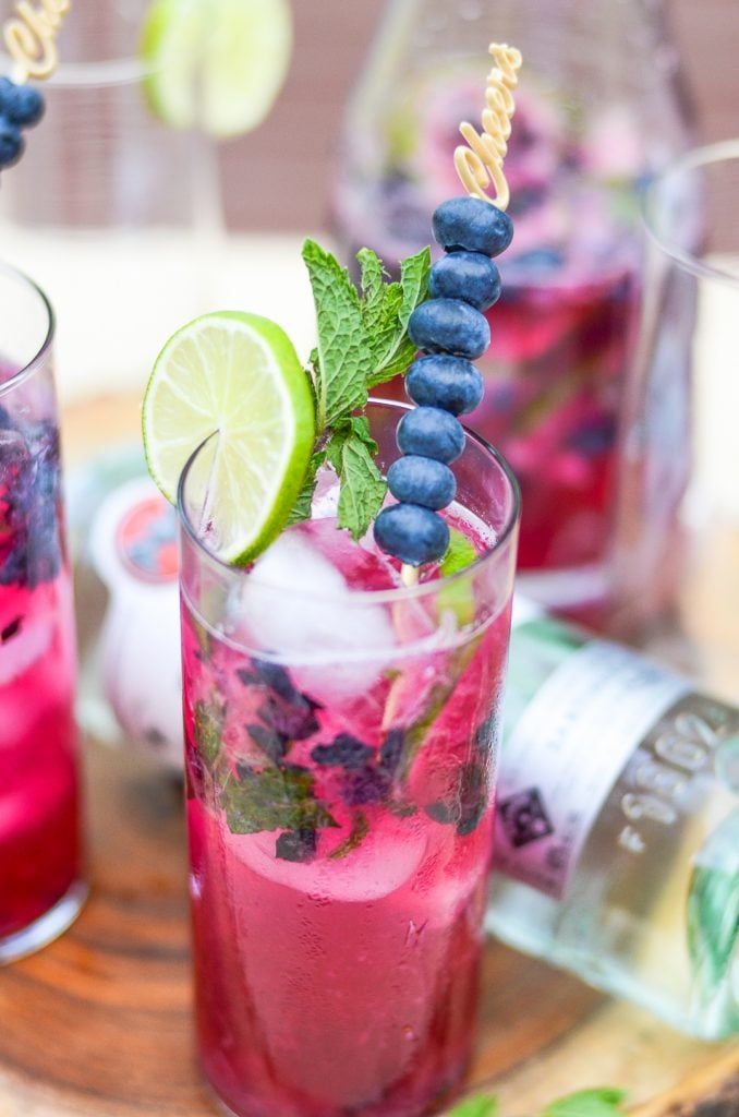 Close up of a glass of blueberry mojito