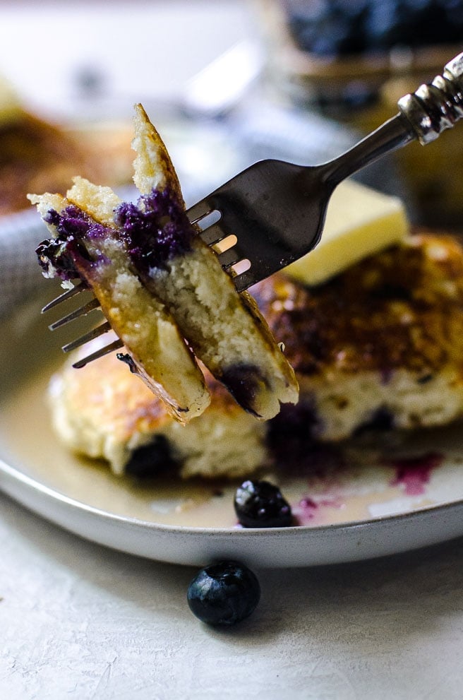 Close up of what the inside of a cooked blueberry pancake looks like.