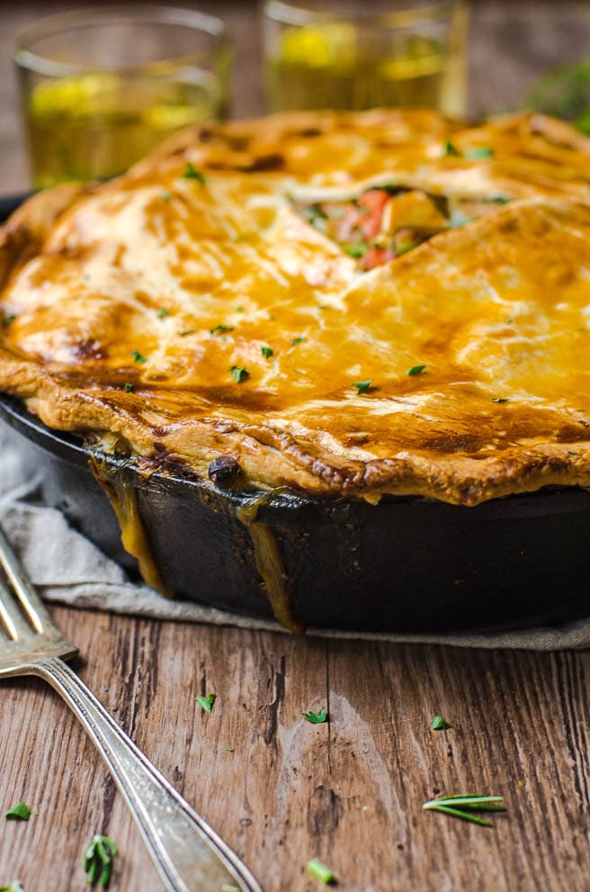 The gravy filling bubbling out of a pot pie.