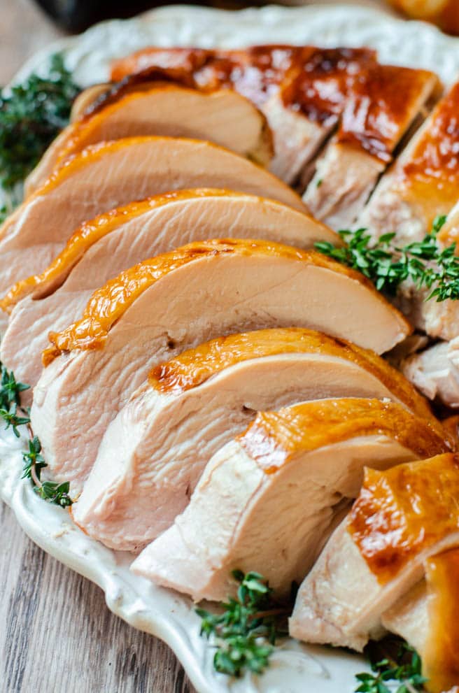 The moist and juicy inside of a roasted turkey breast arranged on a platter.