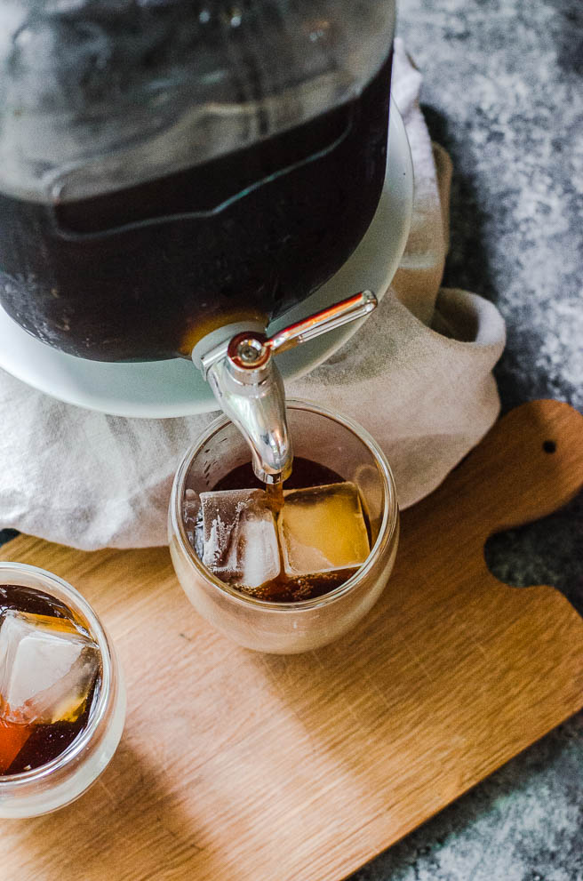 Overhead view of coffee pouring into a cup.