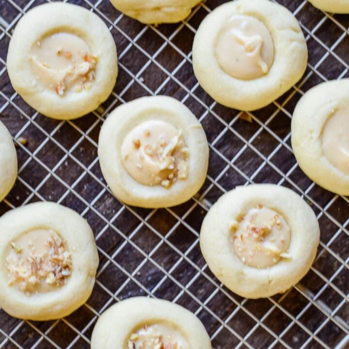 A cooling rack holding cookies topped with icing