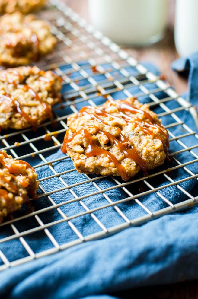 Salted caramel sauce drizzled on a hazelnut cookie.