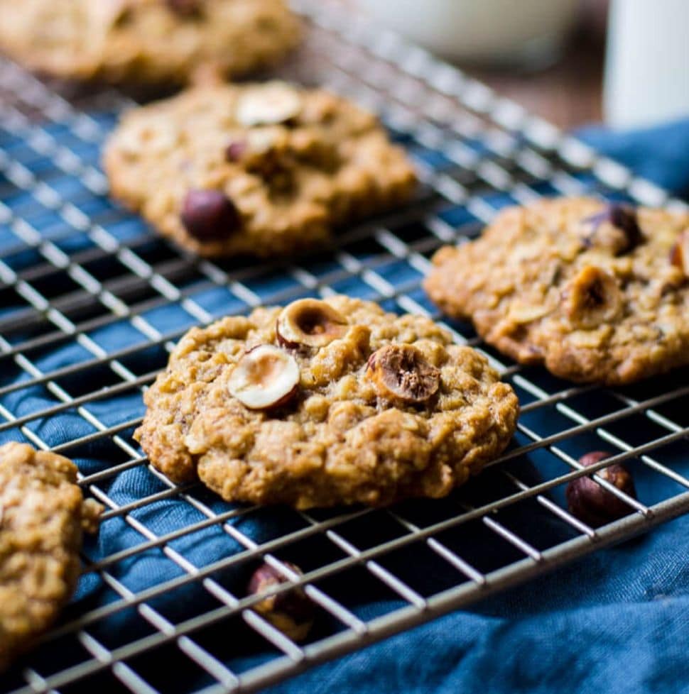 Chewy hazelnut oatmeal cookies on a cooling rack.