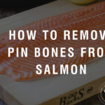 A salmon fillet on a cutting board with a black overlay and text saying "how to remove pin bones from salmon".