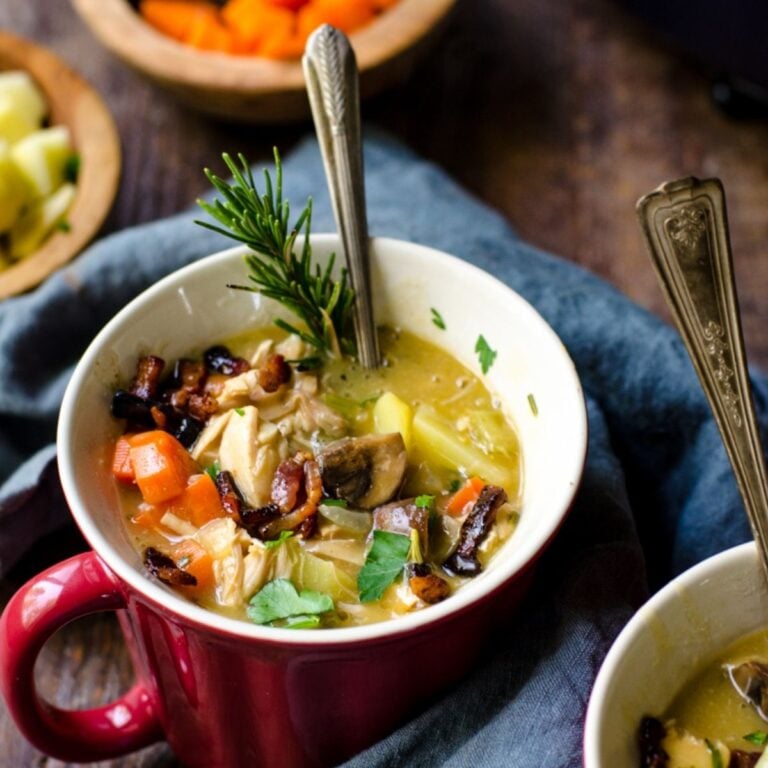 A red bowl holding soup