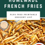 Overhead view of homemade french fries on a sheet pan with dipping sauces. Recipe title above it is on a green background.