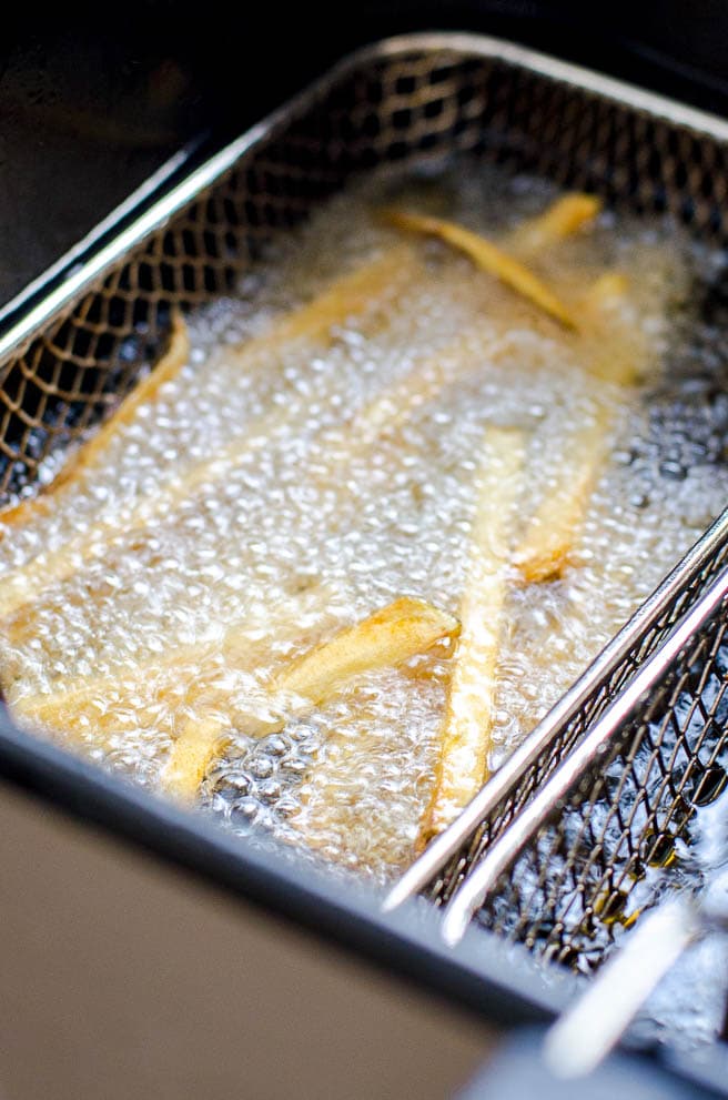 Homemade french fries in a deep fryer.