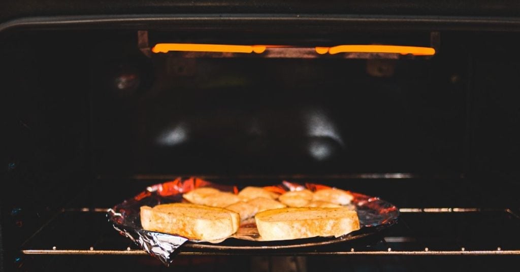 a glowing broiler showing how to broil so you don't burn food.