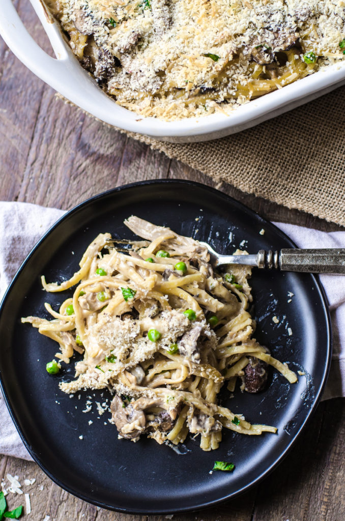 Overhead view of a fork dipping into a plate of turkey tetrazzini.