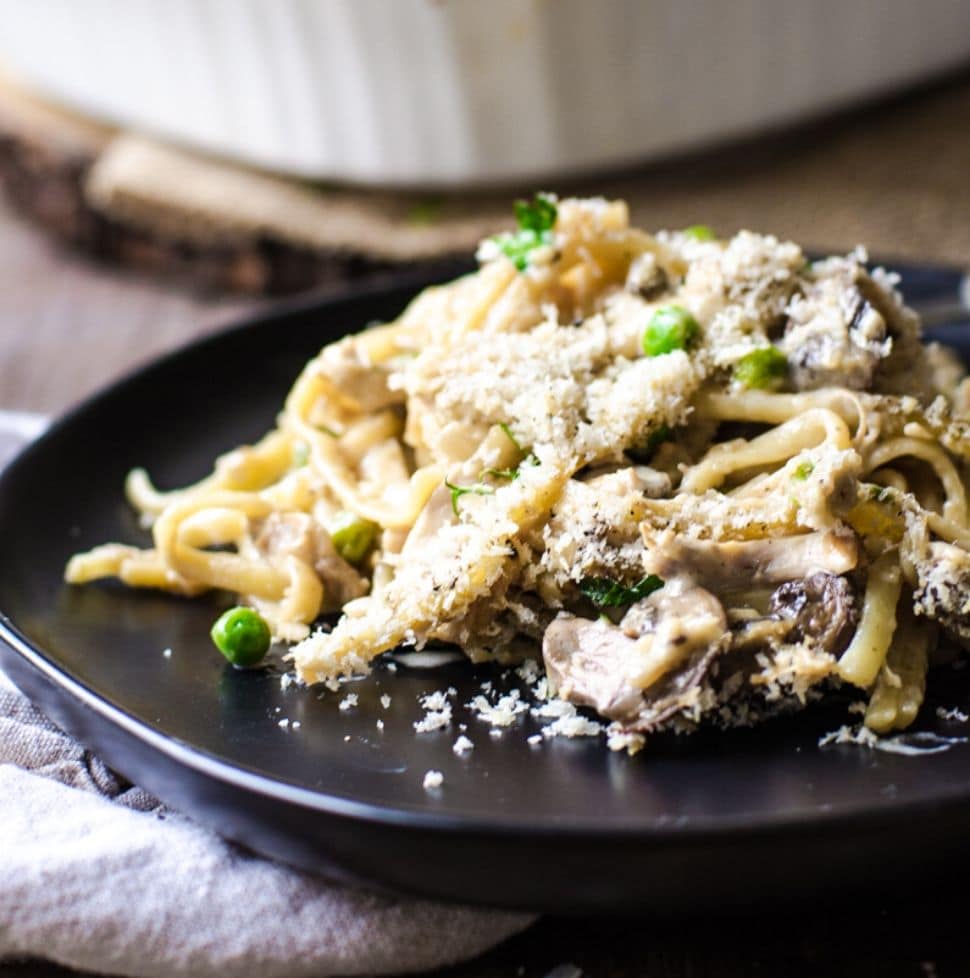 A black plate piled high with turkey tetrazzini.