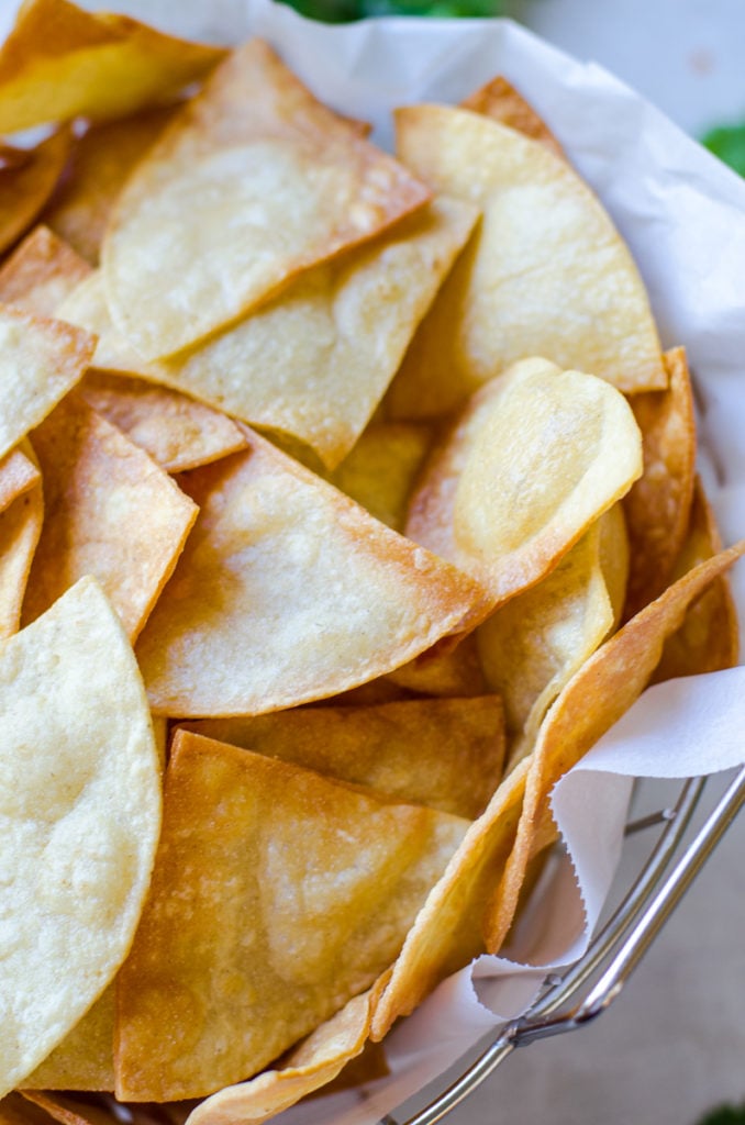 Close up of a basket of crispy chips.